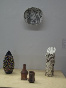 Works by Ryan McKerley (on wall), Grace Nickel, faculty at University of Manitoba, and wood-fired forms by U of M student Vera.